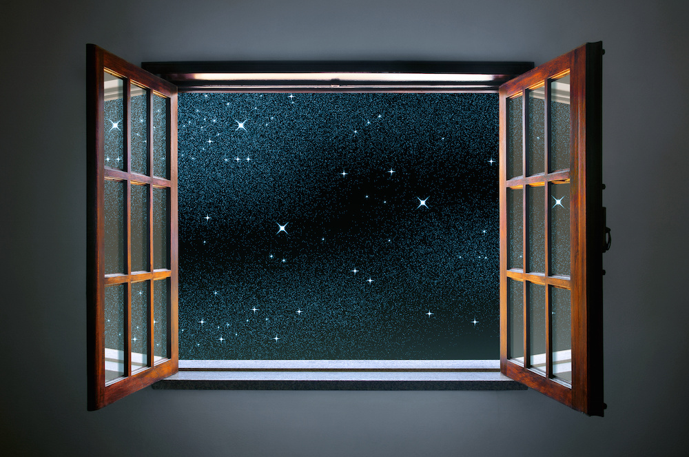 Room window wide open to a calm and clear starry night sky
